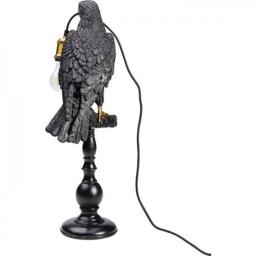 Pássaro preto pose lâmpada corvo o corvo