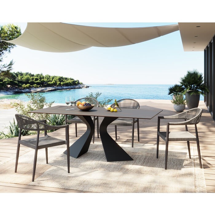 Outdoor dining table GLORIA black stoneware and sculptural base KARE Design — styled on a terrace (3)