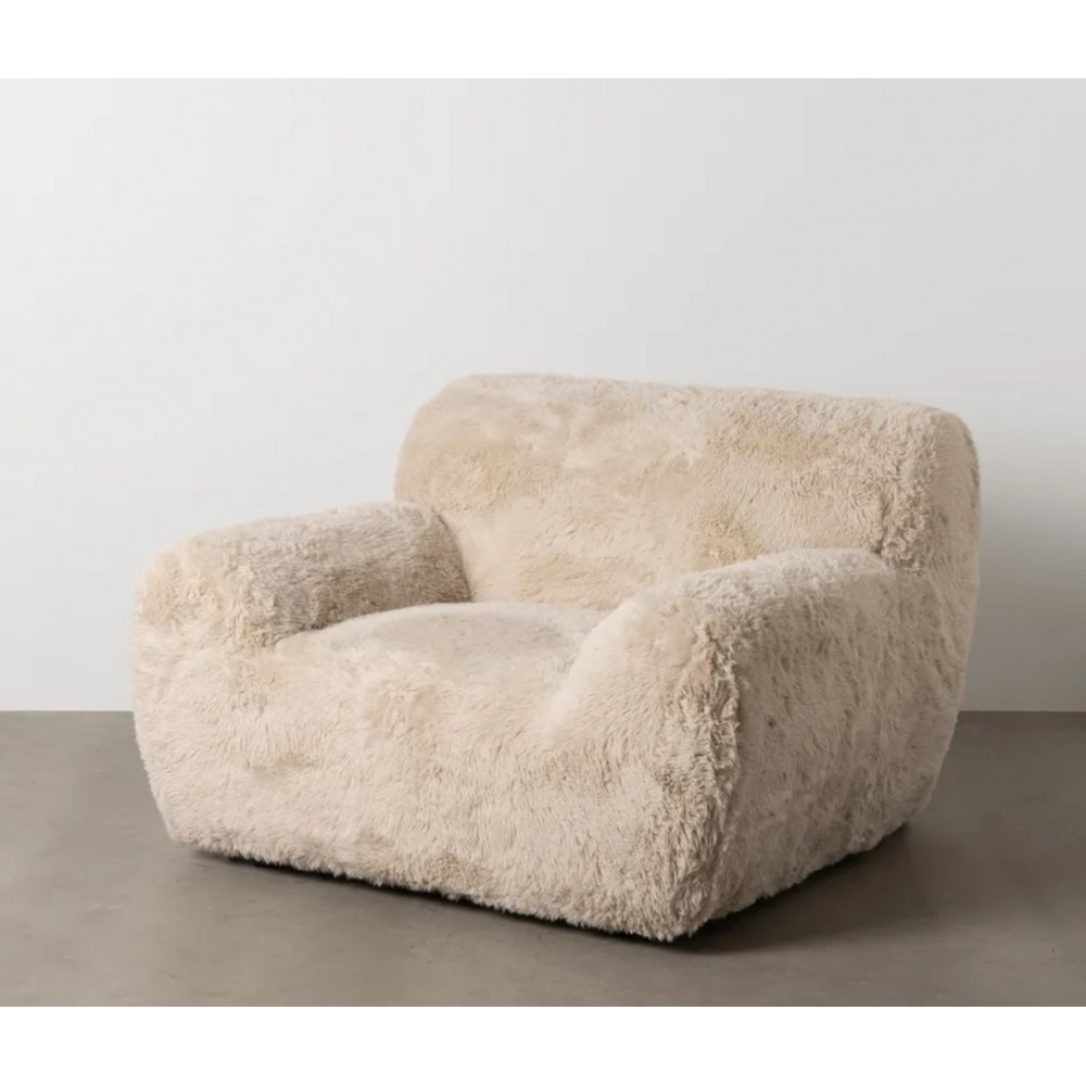 Dining chair IXIA beige faux fur and embracing seat — styled in an interior