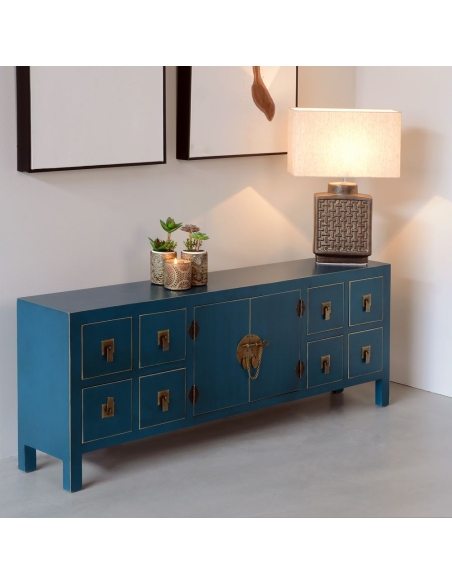 Mueble TV ORIENTE azul petróleo con cajones y herrajes IXIA — ambientado en un salón