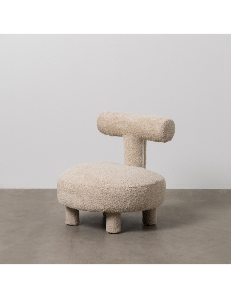 Studio view : beige fabric lounge chair, round seat and T-shaped backrest