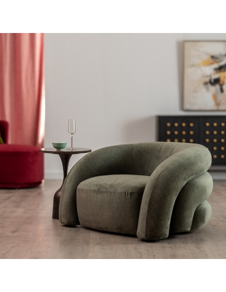 Vista ambientada : Sillón verde de tela con respaldo curvo capitoné